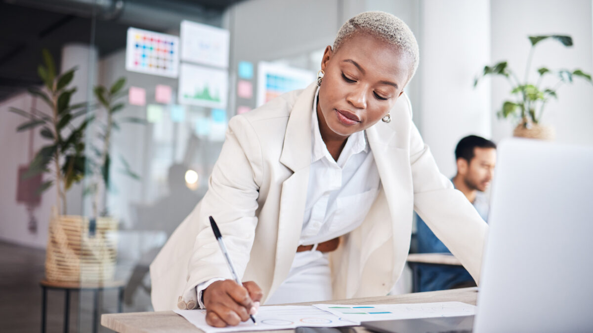 Business woman writing notes