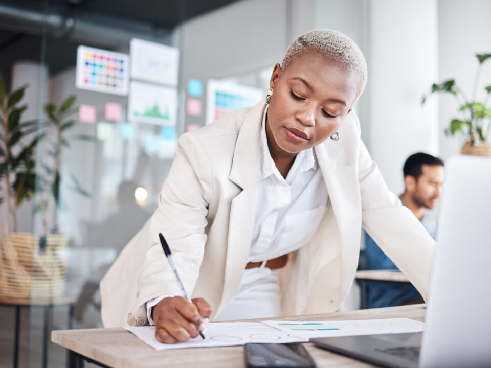 Business woman writing notes