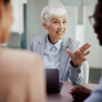 Financial advisor communicating with couple during the meeting in the office.